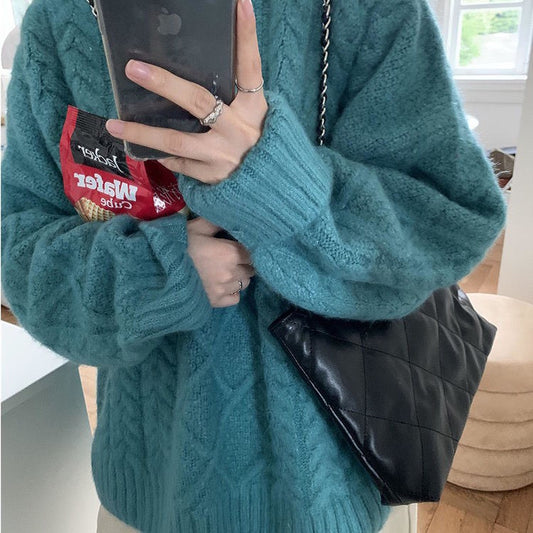 Women Wearing Loose Sweaters Outside The Street With Gentle Wind